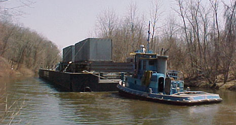Barge with steam generator components travelling on the canal
