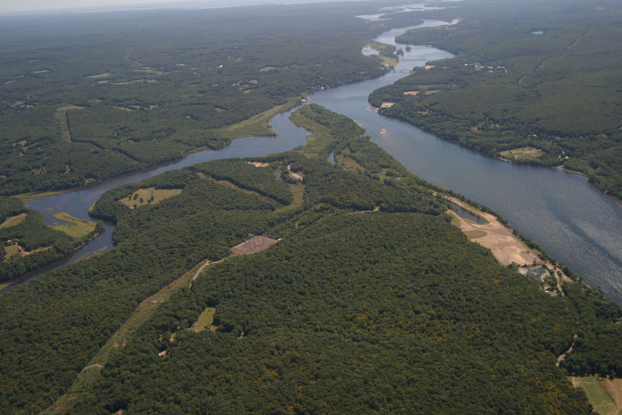Overall view of the site including the lush forests and its placement on the Connecticut River