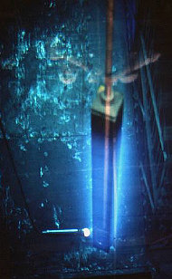 A spent fuel rod exhibiting Cherenkov radiation underwater