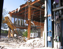 Frame of the administration building amid concrete rubble