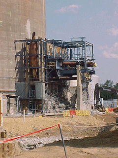 Terry turbine structure adjacent to the containment building, with outer shell removed